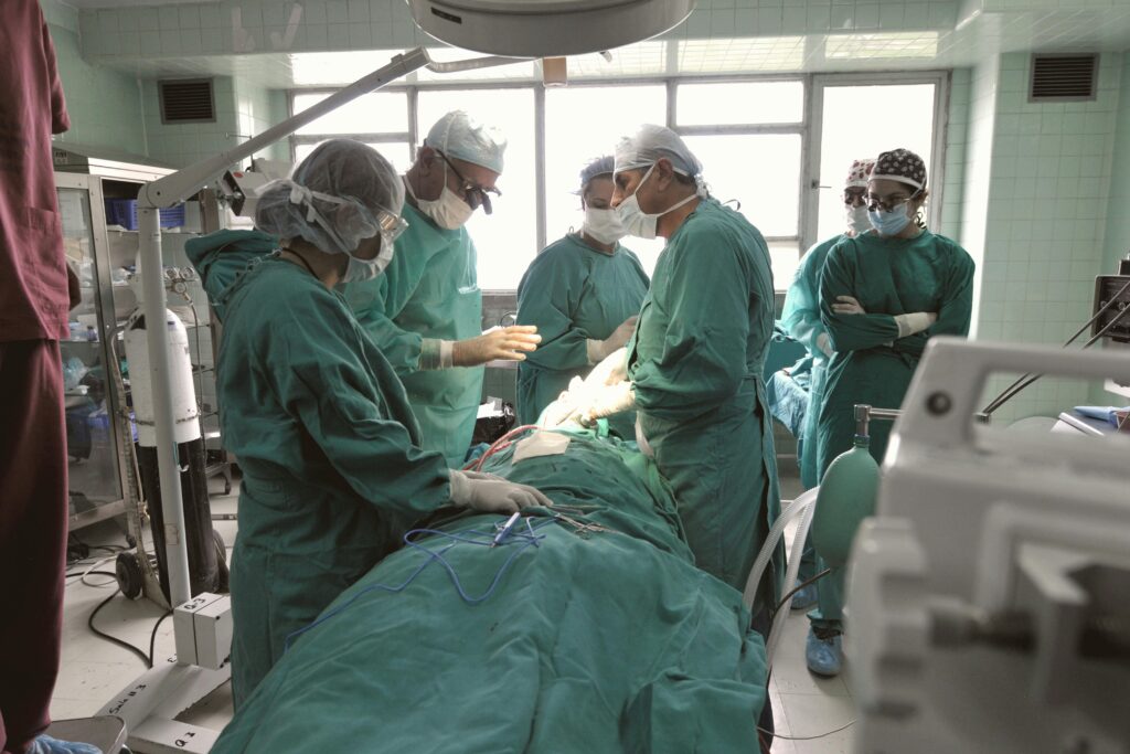 A team of surgeons in an operating room focused on a critical procedure.